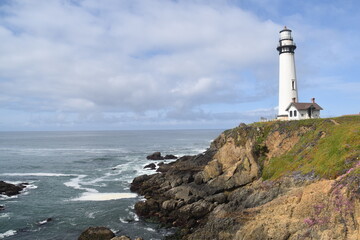 The old historic Pigeon Point Light Station Lighthouse and coastal landscpaes on the Pacific West Coast of California