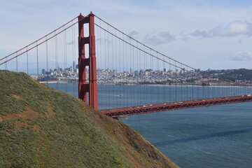 The view over the red Golden Gate Bridge and the San Francisco Skyline in California