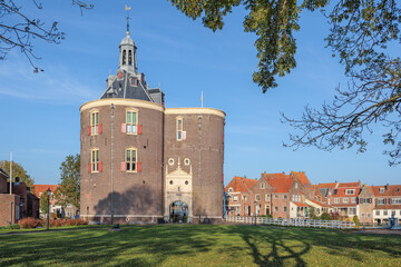 The Drommedaris, a historic city gate in the Dutch city of Enkhuizen, captured on a bright day in early autumn.