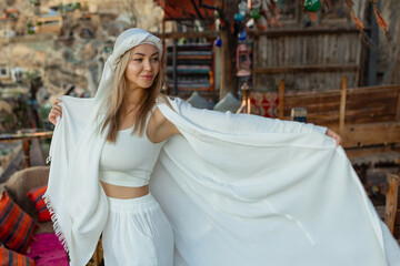 Portrait of a beautiful woman in Arabic clothing in Egypt during sunset.