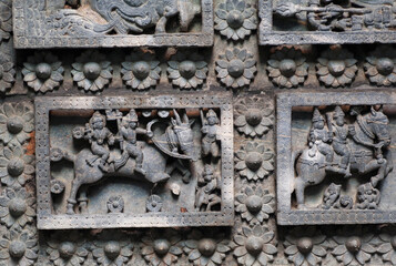 Horses and ancient riders, design on ceiling of an abandoned stone temple, India.