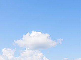 White fluffy clouds drifting across a clear blue sky on a sunny summer day, summer, white, calm