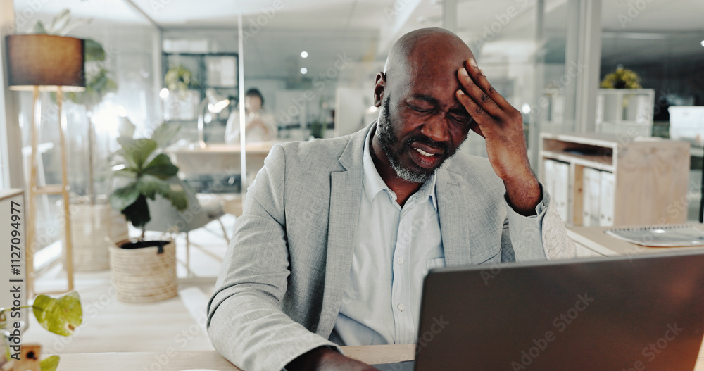 Poster headache, laptop and stress with business black man at desk in office for audit or tax deadline. bur