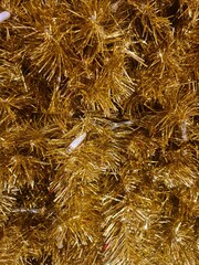 minimalistic background picture / wallpaper design - close up details of a golden christmas tree