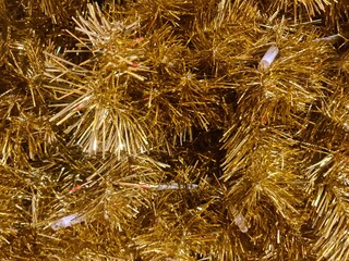 minimalistic background picture / wallpaper design - close up details of a golden christmas tree