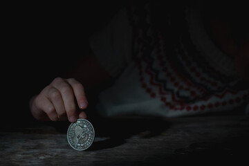 Young frustrated, desperate and sad girl counting small money. Bankrupt, poverty, tax, money...