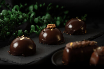Delicious mousse cakes coated in chocolate glaze