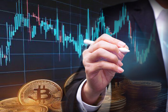 Businessman holding a stylus pen with showing digital virtual graph stock, bitcoin. Business success, hologram business glowing and future technology..