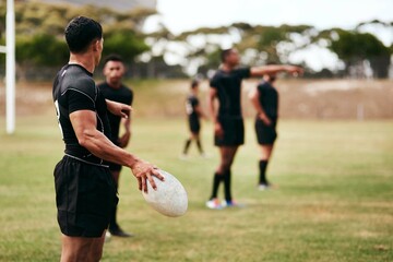 Fitness, outdoor and team of rugby players at match, training or competition with opponent. Ball, sports and men athletes playing game for practice, workout or exercise of skill on field at stadium