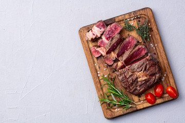 Ribeye grilled  beef steak sliced . Rare doneness photography . Top view