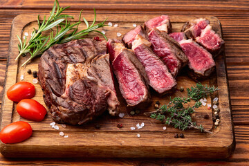Ribeye grilled  beef steak sliced . Rare doneness photography . Top view