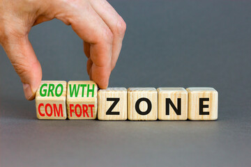 Comfort or growth zone symbol. Concept words Comfort zone Growth zone on wooden cubes. Beautiful grey table grey background. Psychologist hand. Business and comfort or growth zone concept. Copy space.