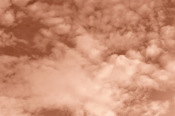 Fluffy curly clouds on sky. Textured Mocha brown background for design. Selective focus. Demonstrating color of 2025 year