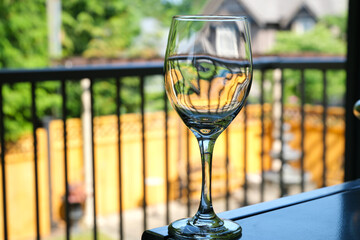 empty wine glass with reflection. Empty wine glass isolated on white background. Transparent wine glass.