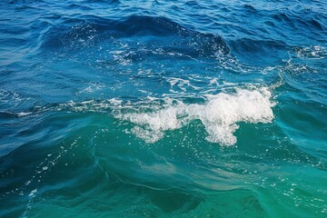 Fototapeta premium A photo of a mesmerizing aquatic scene where a deep blue ocean meets a lighter turquoise sea