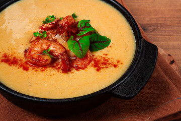 pumpkin cream soup with shrimp, herbs and spices, homemade, no people,