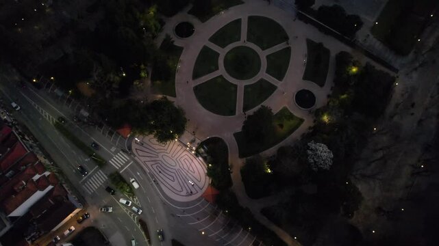 aerial circle view of the night Porto street with car traffic