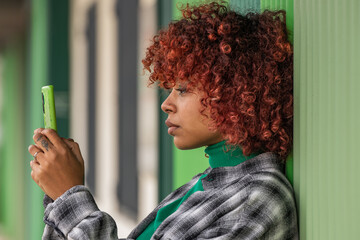 girl looking at mobile phone or smartphone