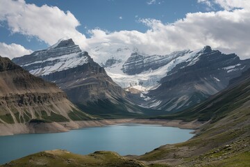 Naklejka premium A breathtaking landscape dominated by towering snow-capped mountains in the backgroun