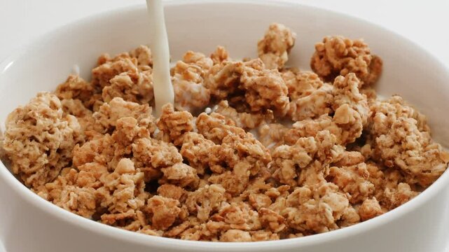 Whole grain cereals with fresh milk for breakfast, healthy breakfast with blueberry berries and yougurth kefir. Cooking morning breakfast.