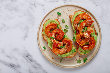 sandwiches with avocado and caramelized shrimp, micro-greens, breakfast, on a plate, top view, homemade, no people,