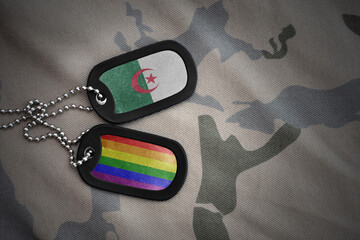 army blank, dog tag with rainbow gay pride flag and algeria on the khaki texture background....