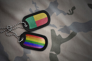 army blank, dog tag with rainbow gay pride flag and benin on the khaki texture background. military...