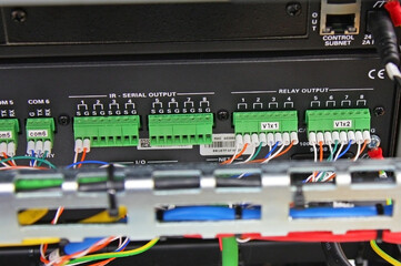 Connection of electronic modules in a multimedia telecommunication rack. Soft focus. 