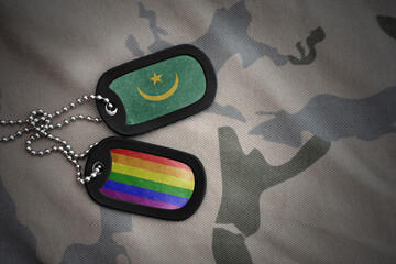 army blank, dog tag with rainbow gay pride flag and mauritania on the khaki texture background....
