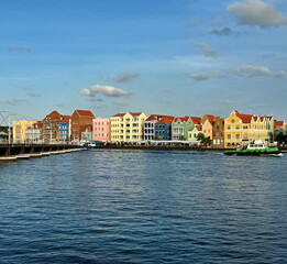 Curacao with the typical colorful houses of the city center by the sea