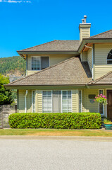 Fragment of  luxury house in summer with green trees and nice landscape in Vancouver, Canada, North America. Day time on June 2024