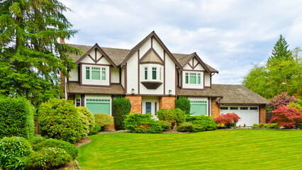 Fragment of  luxury house in summer with green trees and nice landscape in Vancouver, Canada, North America. Day time on June 2024