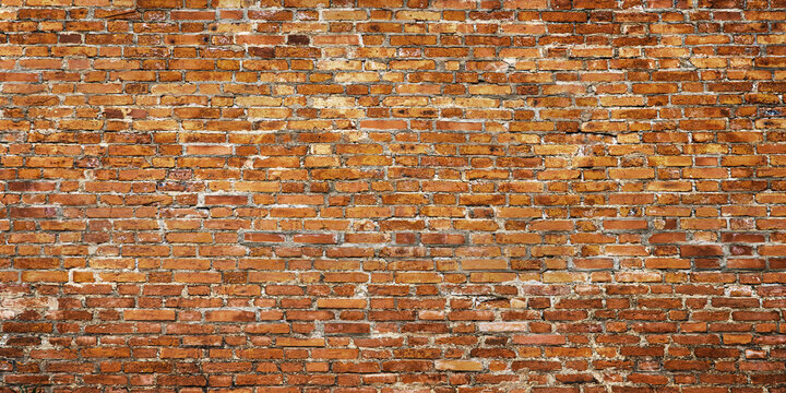 vintage brick wall as a backdrop, red cobblestone masonry texture