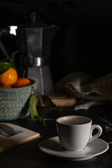 La prima tazzina del caffè la mattina presto. Luce tenue ed un buon libro.