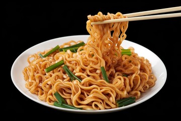 A photo of a golden brown plate of twisted noodles interspersed with green sliced vegetables