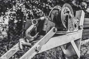 Close-up of a winch with a large, metal hook.
Capstan winch for transporting boats.