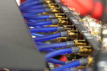 Connection of electronic modules in a multimedia telecommunication rack. Soft focus. 