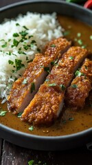 A delicious plate featuring crispy chicken, rice, and flavorful sauce.