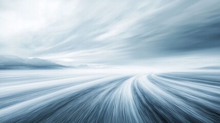 Abstract motion blur of a road vanishing into a hazy mountain landscape.