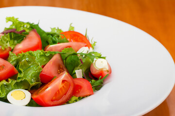 With salad of tomatoes, lettuce and cheese. A plate of white salad with vegetables. A plate of salad with sliced tomatoes and a white plate. A plate of salad with white lifestyle sliced tomatoes and.