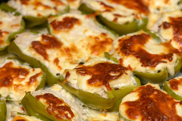 Delicious stuffed green peppers baked to perfection with creamy filling and golden cheese