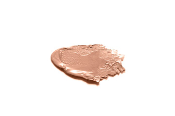 Smooth smear of beige makeup foundation on a white background, showcasing a creamy texture. Color of the year 2025 - Mocha Mousse