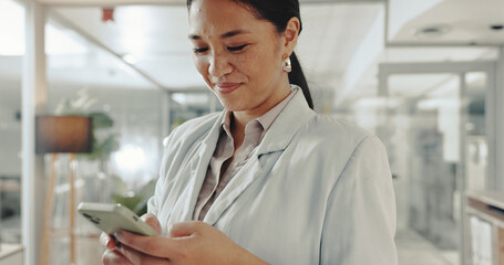Email, cellphone and businesswoman in office with typing for connectivity, communication or...