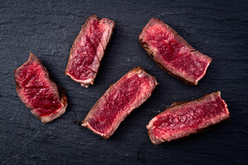 Ribeye grilled  beef steak sliced . Rare doneness photography . Macro shot . Top view