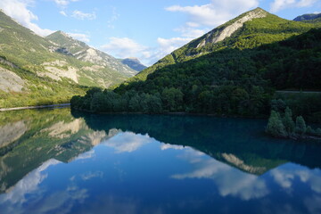 panoramic view of Serre Ponçon lake, Southern Alps, France with mirror reflection