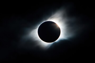 Naklejka premium A large black sun is in the center of the image