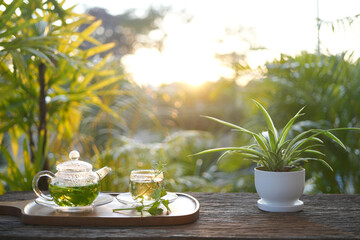 herbs tea, coriander, Lemon balm, Rice Paddy Herb in a glass teapot