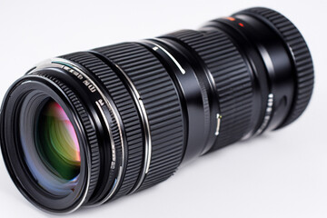 Fototapeta premium Camera with lens on it is shown. A white and camera with a white background lens. Black and white camera lens with a black background. Black and white camera lens with a black lifestyle background.