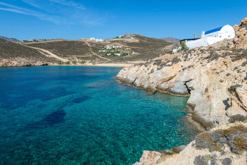 Obraz premium View of rustic Agios Sostis church perched on the rocky cliffs above a beach with the same name on the Greek island of Serifos.