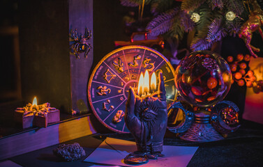 Rite with a burning candle, night mystery atmosphere, Christmas eve, Yule or another day